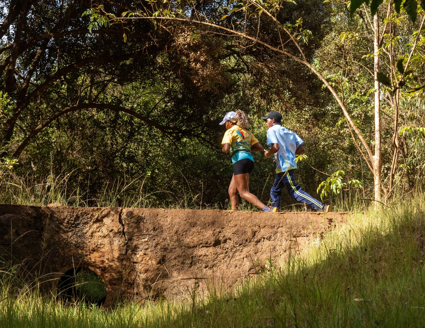 Two people jogging on a forest trail in Nairobi